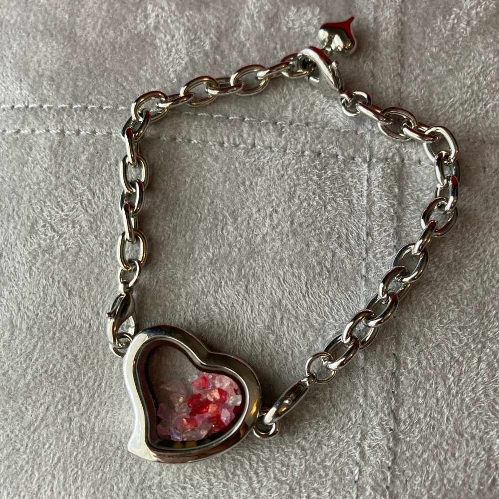 NWOT: clear heart locket bracelet with red and pink glass